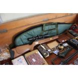 A Crosman .22 air rifle with telescopic sights and