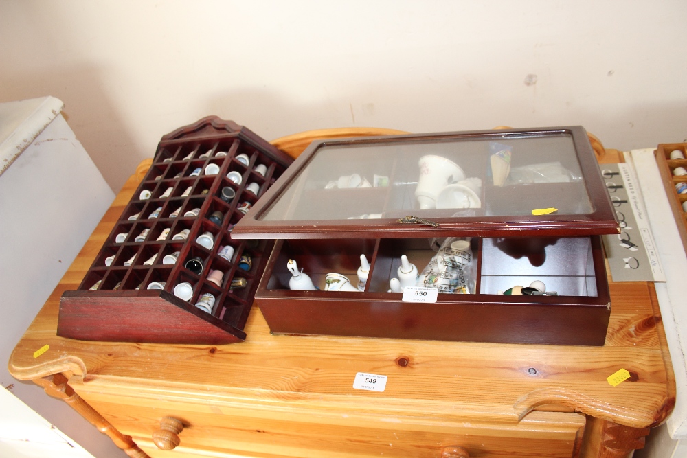 Two cases of china thimbles and bells etc