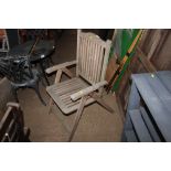 A hardwood folding garden chair