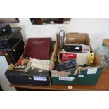 Two boxes containing various books; car radios and