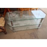 A large three tier glass television stand