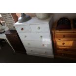 A white painted pine chest fitted two short over t