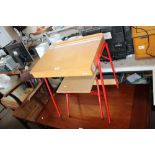 A child's school desk and stool