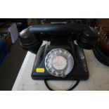 A rotary dial Bakelite telephone