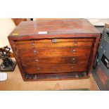 A table top nest of drawers