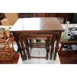 A nest of three oak occasional tables