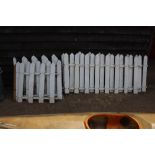 A quantity of white picket fencing