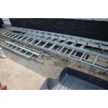 A large quantity of aluminium ladders