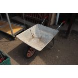 A galvanised wheelbarrow