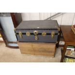 A travelling trunk; and a storage chest