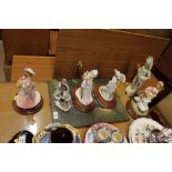 Six various figurines and a coloured print