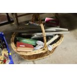 A basket of various sundries to include coat hange