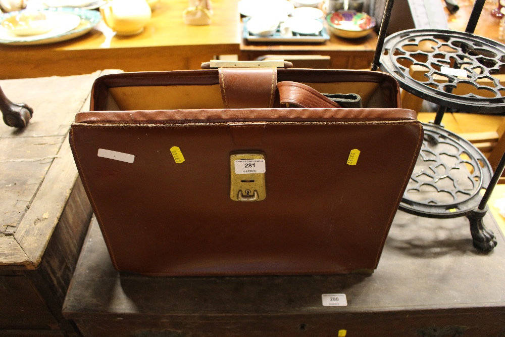 A leather briefcase with leather wallet, belts etc