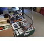 A box of various games and DVDs etc.