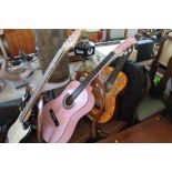 A Herold pink acoustic guitar