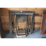 An Art Nouveau cast iron fireplace, fire basket, g