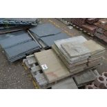 Two pallets of concrete, sandstone and slate slabs