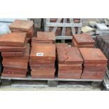 A pallet of red tiles