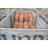 A crate of used roof tiles