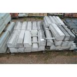 A large quantity of large concrete wall cappings