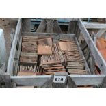 A crate of concrete peg tiles