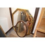 A large decorated octagonal wall mirror and an oak