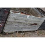 A crate of terracotta roofing tiles