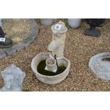 A pre-cast garden water feature comprising pump an