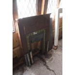 An Edwardian cast iron and tiled fireplace