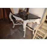 A painted wooden console table with marble top