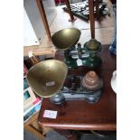 Two sets of cast iron and brass kitchen scales and