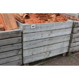 A large crate of roofing tiles