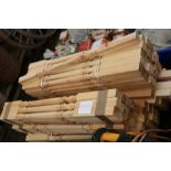 A quantity of pine stair banister rails