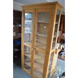 A light oak china display cabinet, 100cm wide x 19