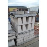 A quantity of large shaped concrete window sils