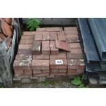 A pallet of paving bricks