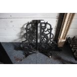 A pair of cast iron brackets and a pair of wall mo