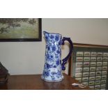A blue and white floral pattern china jug