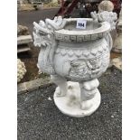 A garden marble bird bath with Chinese dragon decoration.