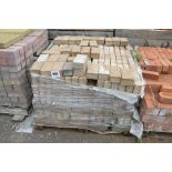 A pallet of paving bricks