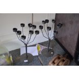 A pair of metal ware candelabra