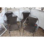 Four metal and wicker garden chairs