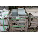 A crate of green slate slabs