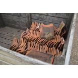 Two crates of used roof tiles