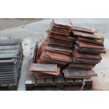 A pallet of terracotta roof tiles