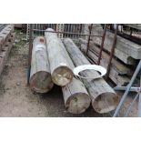 A quantity of four part telegraph poles