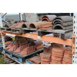 A large quantity of various ridge tiles, floor pan