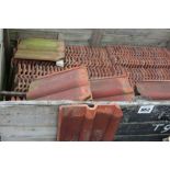 A crate of terracotta roofing tiles