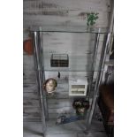 A glass and chrome five tier display stand