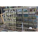 A modern wrought iron gate, approx. 130cm x 120cm